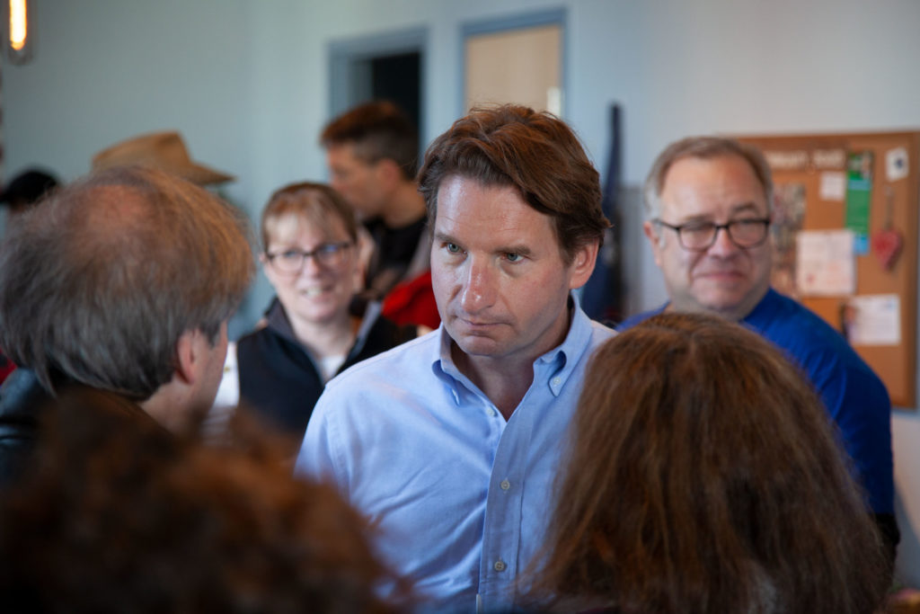 Dean Phillips listens to voters at the chili cook-off.