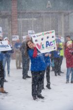 A supporter holds a homemade Phillips sign on caucus night. A supporter holds a homemade Phillips sign on caucus night.