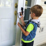 A young boy delivers Phillips for Congress campaign literature. A young boy delivers Phillips for Congress campaign literature